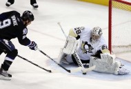 The number one star Steve Downie working hard as he scores the game winner. (photo by Kim Klement/US Presswire)