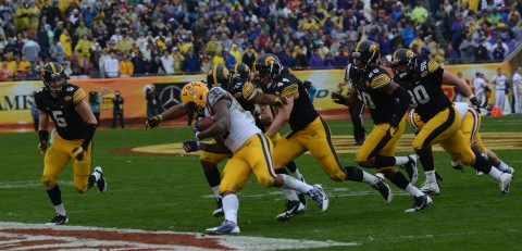  Jeremy Hill still managed 217 yards in spite of being surrounding by Hawkeyes (photo by Travis Failey / RSEN) 
