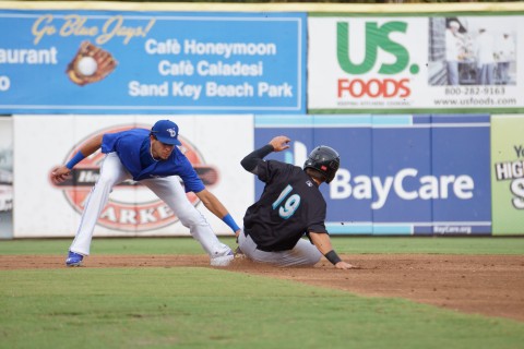 Jupiter Hammerheads second baseman Avery Romero slides into Dunedin Blue Jays short stop Emillo Guerrero's tag on Saturday night to end the second inning at Florida Auto Exchange Park.  Dunedin won the game that lasted 3:14, 12-7 (Eddie Michels/Photo)