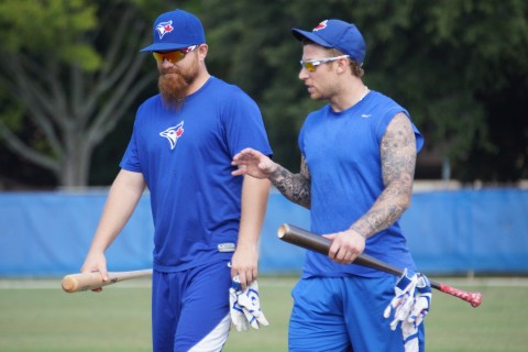 Adam Lind (L) and Brett Lawrie walk for the cage together (Eddie Michels/Photo)