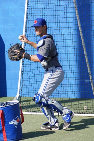 Max Pentecost (injured left wrist, right hand) appears to have no problems going through catching drills at the Toronto Blue Jays Instructional League camp on September 18, 2014.  Taken 11th overall during this years June Draft Pentecost has been on the mend with the problem of his left wrist since early August. (EDDIE MICHELS/PHOTO)