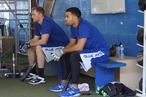 Michael Saunders and Dalton Pompey watch as other early arrivals for the Toronto Blue Jays take batting practice in the cage at the Mattick Complex.  With Saunders (Victoria, BC) being a left fielder and Pompey (Toronto area) a center fielder couple that with catcher Russell Martin (Toronto native) the Blue Jays could have three Canadians in their starting line up for the first time this season. (EDDIE MICHELS/PHOTO)