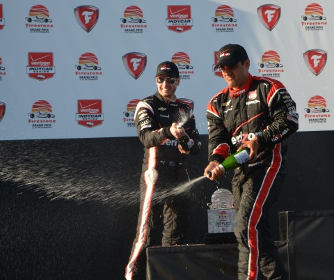 Montoya (foreground) and Power celebrate on the podium with the bubbly (photo Rodney Meyering  / RSEN)