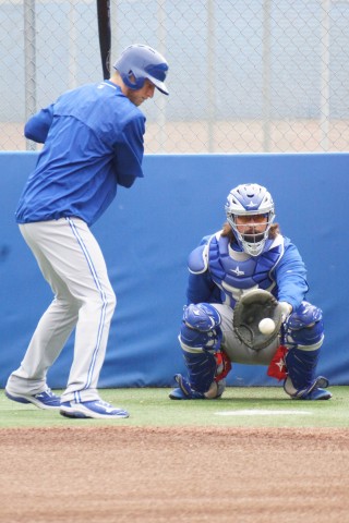 Blue Jays OF Michael Saunders (left knee) might not be able to start swinging a bat yet since his surgery but he can still keep his eye sharp.  Here Saunders watches delivery's from fellow Canadian Jeff Francis. (EDDIE MICHELS PHOTO)