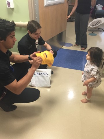 Neil Alberico and Zach Veach have goodies for Kaelyn (photo Brennie / RSEN)