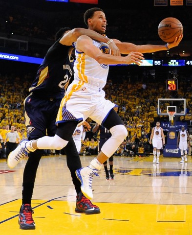 Golden State Warriors guard Stephen Curry (30, right) shoots the basketball against New Orleans Pelicans forward Anthony Davis (23, left) during the second quarter in game one of the first round of the NBA Playoffs at Oracle Arena. The Warriors defeated the Pelicans 106-99.(USA TODAY Sports / Kyle Terada)