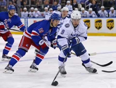 Dec 1, 2014; New York, NY, USA; Tampa Bay Lightning center Tyler Johnson (9) controls the puck in front of New York Rangers right wing Jesper Fast (19) during the first period at Madison Square Garden. (USA TODAY Sports -  Adam Hunger)