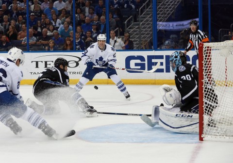 Toronto Maple Leafs center Brooks Laich (23) passes the puck as Tampa Bay Lightning defenseman Jason Garrison (5) defends during the third period at Amalie Arena. Tampa Bay Lightning defeated the Toronto Maple Leafs 3-0. (photo Kim Klement / USA TODAY Sports)