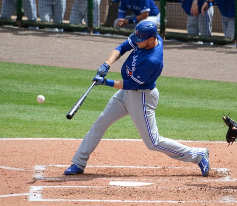 oronto Blue Jays outfielder Michael Saunders smacks an RBI single in the second inning of Saturday's game. (photo Buck Davidson)
